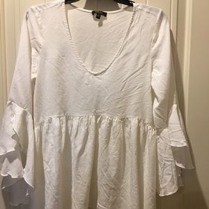 Versona White high low ruffle sleeve blouse.